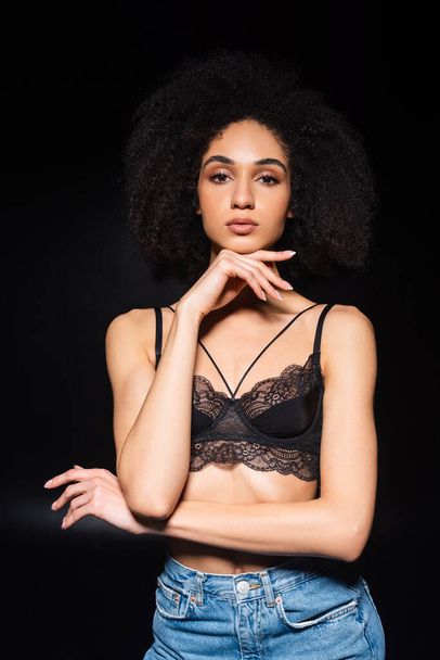 Sexy african american woman looking at camera on black background  - Фото, зображення