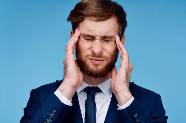 business man in suit with headache  - 写真・画像