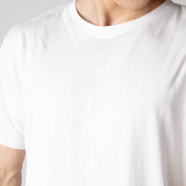 white men's T-shirt close-up on the model. - 写真・画像