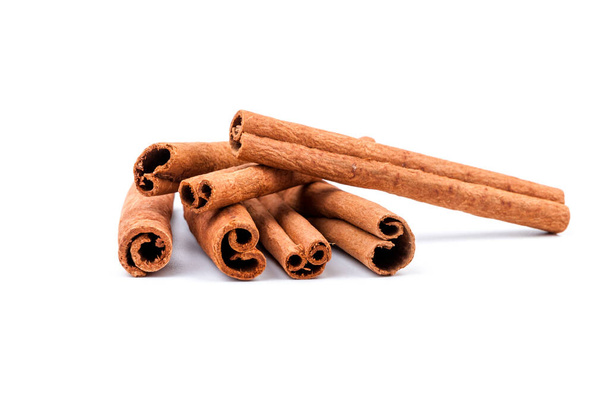 Aromatic dry cinnamon sticks on white background - Photo, Image