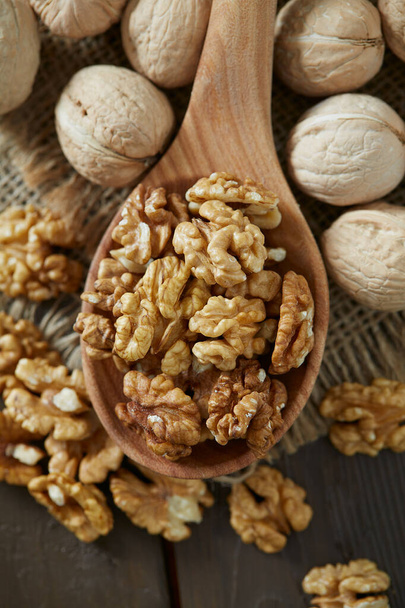 walnuts on wooden surface - Фото, изображение