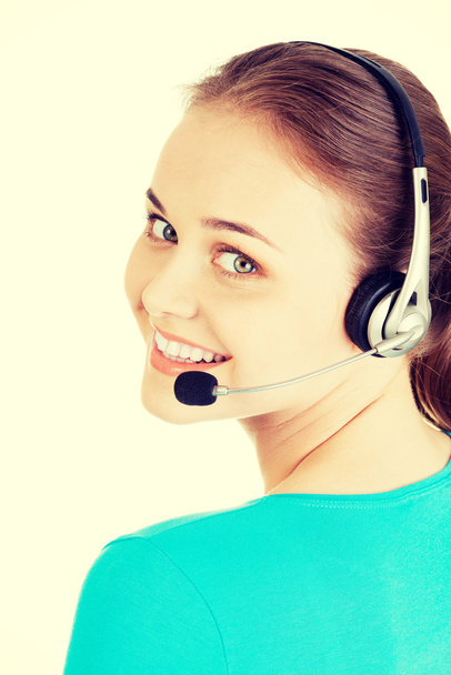 Beautiful young call-center assistant smiling - Фото, изображение
