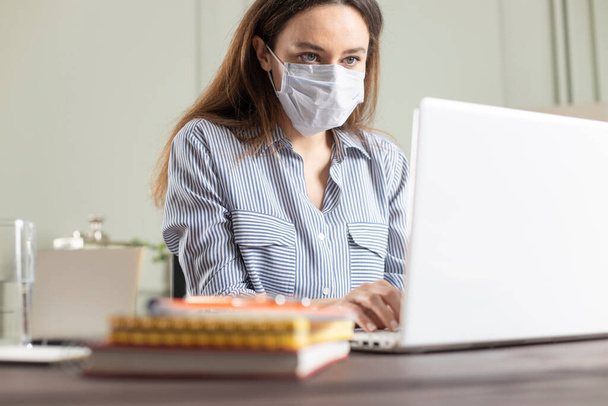 Young woman with face mask on the street.  Coronavirus self-protection concept - Photo, Image