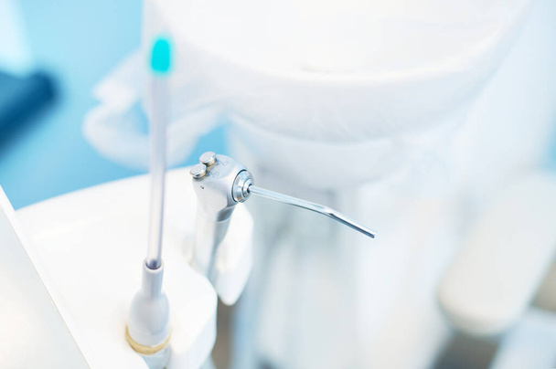 Close-up of dentist equipment in modern dental clinic. Interior of dentist office. Copy space. Healthcare and oral care concept. Dentistry - Foto, Imagem