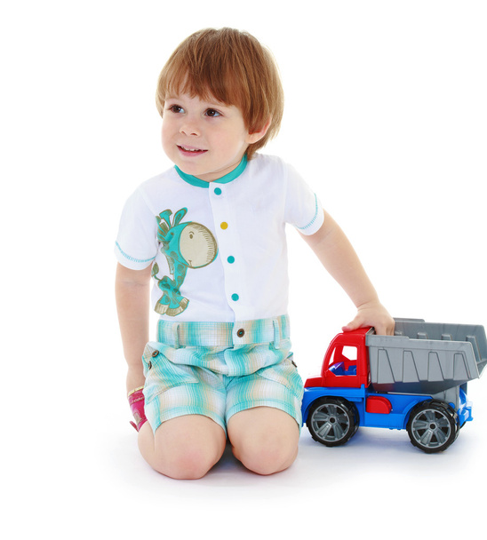 kid boy toddler playing with toy car - Fotó, kép
