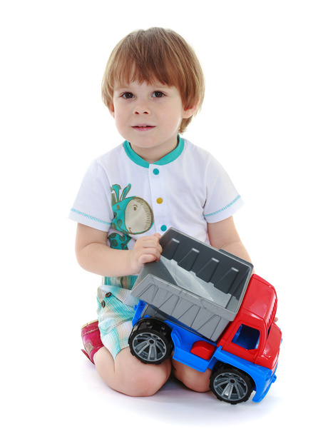 kid boy toddler playing with toy car - Foto, Imagen