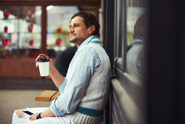 Thoughtful bearded man enjoying his coffee break - Fotoğraf, Görsel