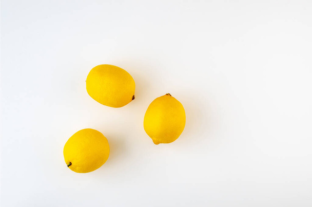 Whole lemons on a white background. Top view. - Fotografie, Obrázek