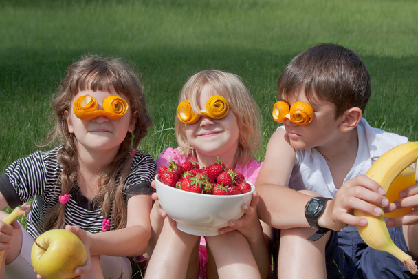 Three crazy little fruit lovers - Photo, Image