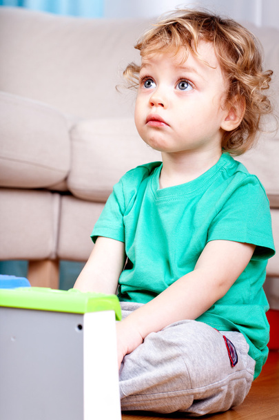 Sad little boy sitting  - Foto, afbeelding