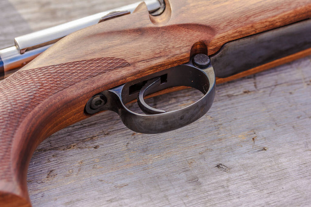 Riffle barrel, gun barrel close up on rustic wooden surface  - Valokuva, kuva