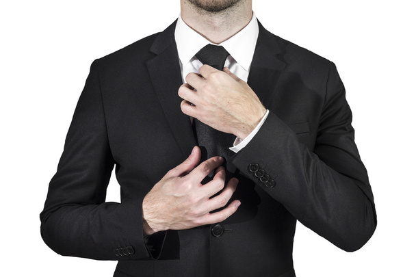 Businessman correcting necktie - Foto, immagini