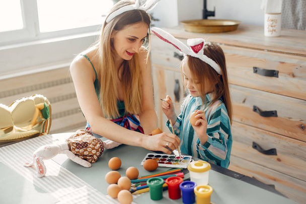 Mother with little daughter in a kitchen - Foto, Bild