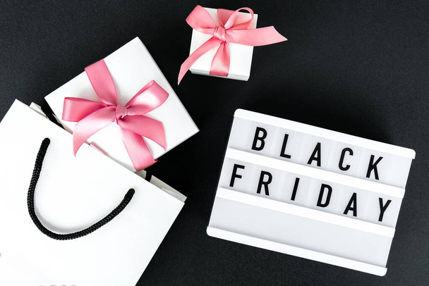Lightbox with text BLACK FRIDAY with paper shopping bags on dark background, Sale shopping concept. Online shopping Template Black friday sale mockup fall thanksgiving promotion advertising Big sale. Cyber monday. Holiday - Fotografie, Obrázek