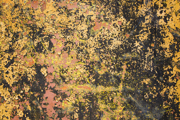 A closeup shot of a textured dirty painted wall - Fotó, kép