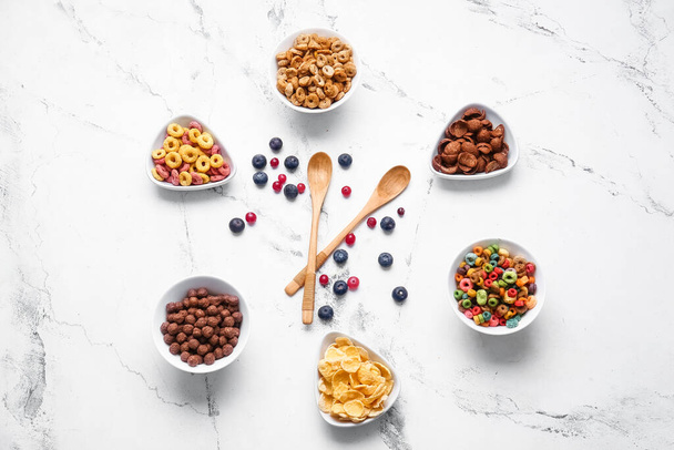 Creative composition with different cereals on light background - Photo, Image