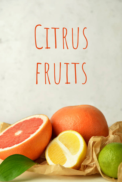 Fresh citrus fruits on light background - Photo, Image