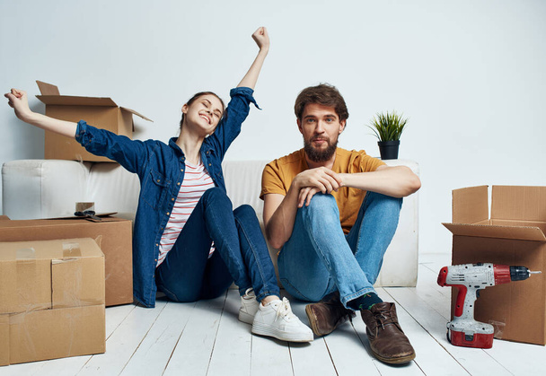 young couple boxes with things new housing family - Photo, Image