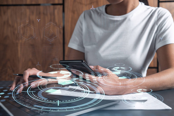 Woman hands typing the keyboard to create innovative software to change the world and provide a completely new service. Close up shot. Hologram tech graphs. Concept of Dev team. Casual wear. - Фото, зображення