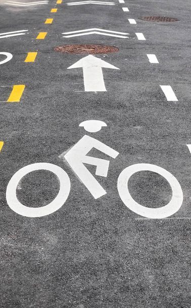 Asphalt bike lane in New York City, focus on the biker symbol, USA. - Photo, Image