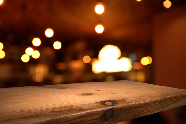 Old wood table with smoke in the dark background. - Foto, Bild