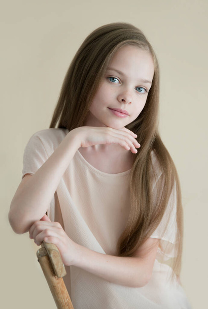 Portrait of cute young girl with long hair. Lightkey. - Foto, Imagen