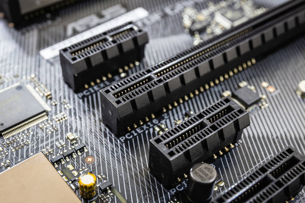 closeup of Pci expess port slot on modern black motherboard. Select focus - Photo, Image