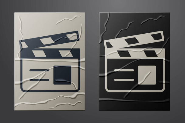 White Movie clapper icon isolated on crumpled paper background. Film clapper board. Clapperboard sign. Cinema production or media industry. Paper art style. Vector - Vettoriali, immagini
