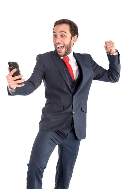 Homme d'affaires heureux ou courtier en valeurs mobilières avec téléphone mobile - Photo, image