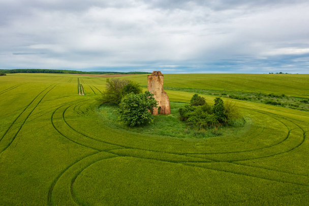 Regoly, Hungary - Aerial view about church ruins in the middle of an agricultural field. Hungarian name is Somolyi templomrom - Photo, Image