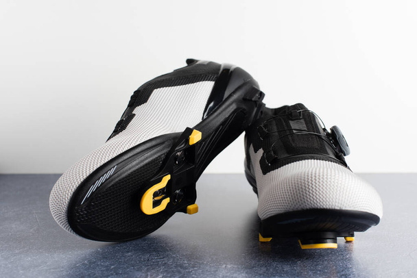 Pair of road cycling shoes with the automatic cleats assembled. - Photo, Image