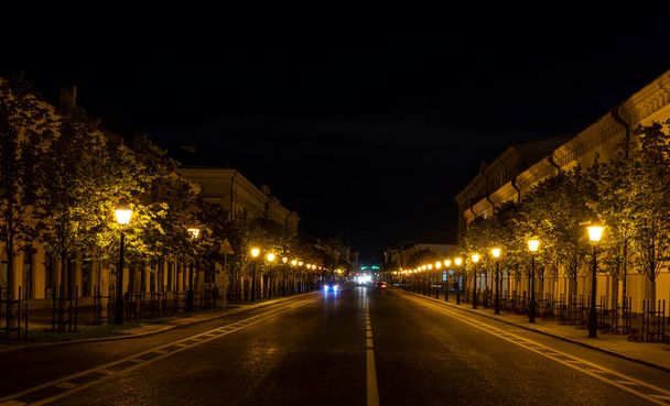 Kazan, Russia - September 21, 2019: Kremlyovskaya Street at  night with cars in the street and many laterns, Tartastan, Russia. - Photo, Image