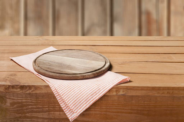 empty wooden table with tablecloth on wood background - Fotografie, Obrázek