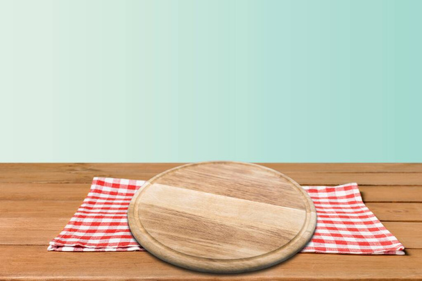 Empty blank wooden board for the dish on the desk. Kitchen background. - Φωτογραφία, εικόνα