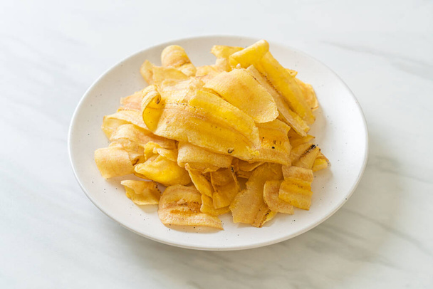 Crispy Banana Chips - fried or baked sliced banana - Φωτογραφία, εικόνα