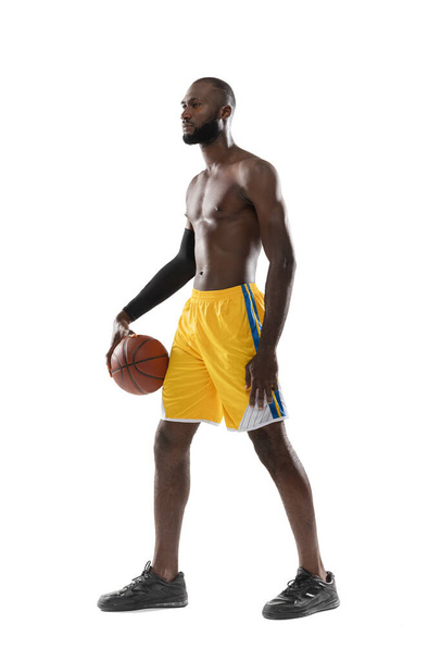 one african man basketball player holding ball in silhouette isolated white background - Photo, Image