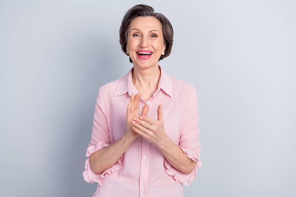 Portrait of attractive cheerful middle-aged woman applauding you success isolated over gray pastel color background - Фото, изображение