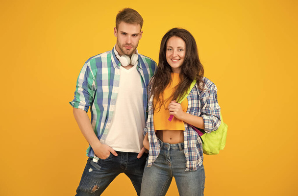Young and free. Happy couple yellow background. Couple in love. Sexy woman and handsome man in casual style. Boyfriend and girlfriend. Love and romance. Fashion trends for youth. Trendy lifestyle - Valokuva, kuva