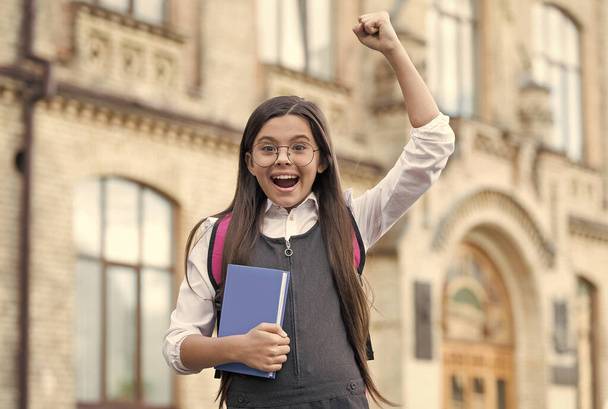 Yes, we make winners. Happy winner outdoors. Small kid make winning gesture. Scholarship winner. Success in study. Back to school. Formal education. Knowledge day. September 1. You can do it - Foto, Imagem