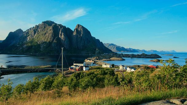 Norway landscape with a beautiful view of a small coastal village and majestic fjord mountains  - Foto, Imagen