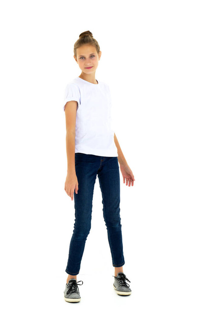 Happy girl standing against white background. Isolated over white background. - 写真・画像