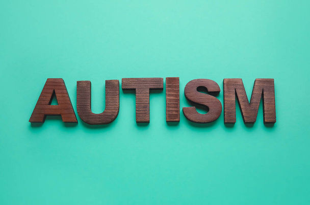 Word AUTISM on color background - Photo, Image