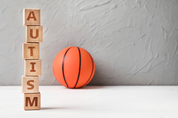 Word AUTISM and ball on light background - Photo, Image