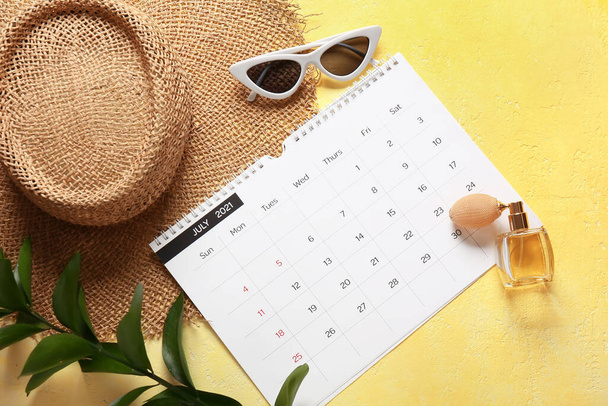 Calendar and female accessories on color background - Photo, Image