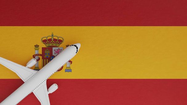 Vista dall'alto verso il basso di un aereo nell'angolo in cima alla bandiera del paese della Spagna - Foto, immagini