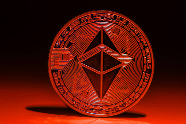 valueable single red shining ether coin from ethereum with shadow - Photo, Image