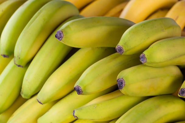 Ripe bananas on the counter in a grocery store - Photo, Image