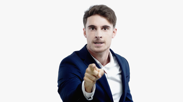 Irritated businessman pointing at camera isolated on white  - Photo, Image