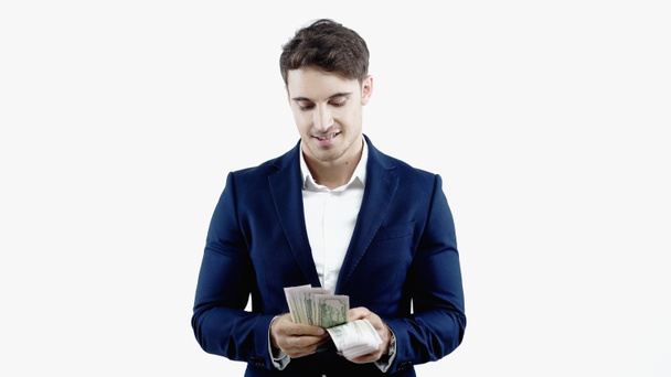 Un homme d'affaires prospère compte les dollars isolés sur blanc - Photo, image