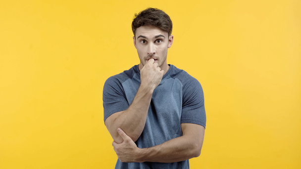 Stressed man looking at camera isolated on yellow  - Photo, image